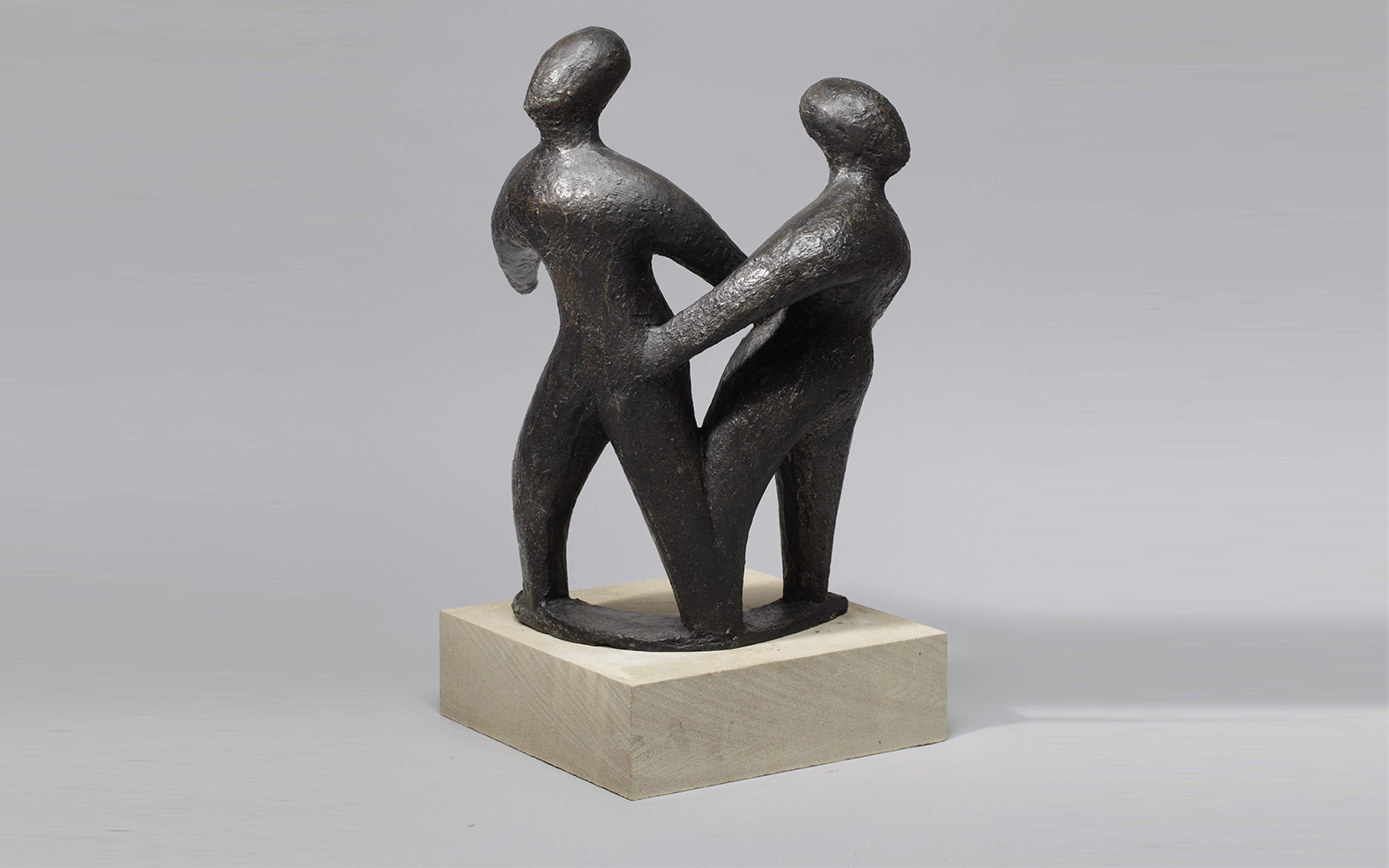 contemporary bronze sculpture of two dancing abstract figures for interior design