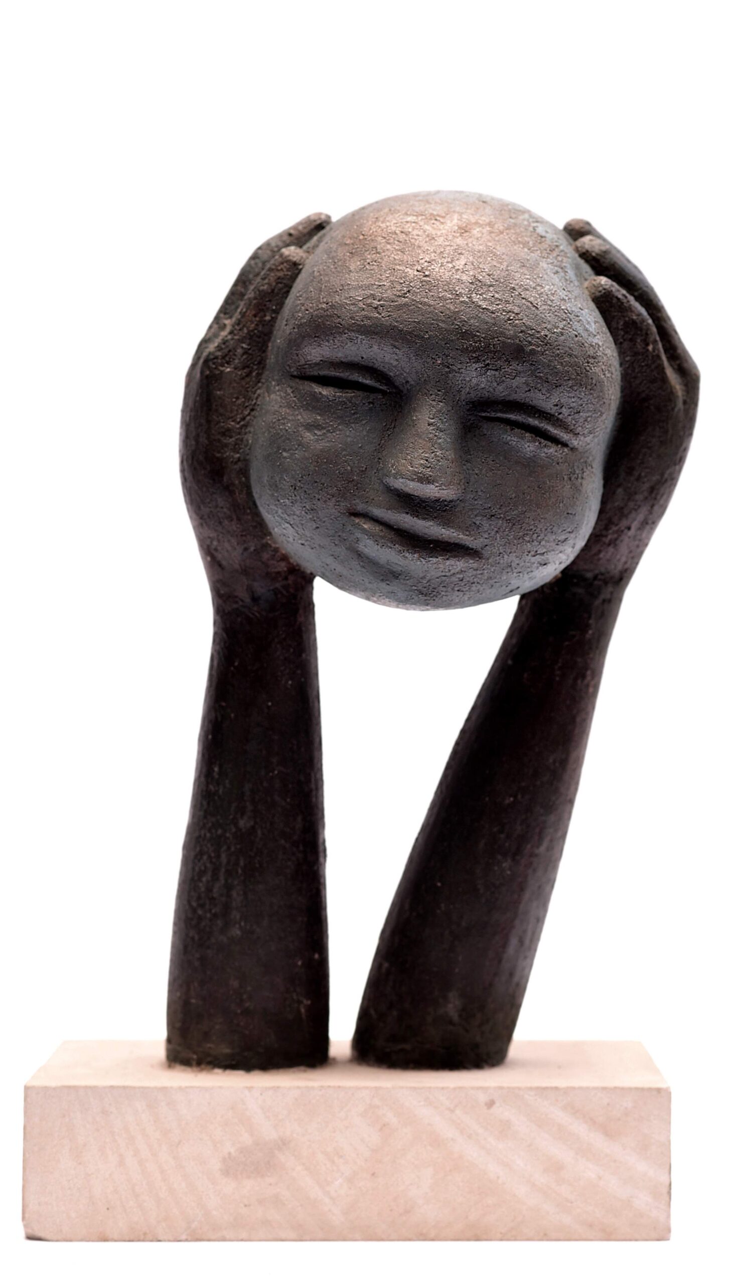 contemporary sculpture of a head held up on its hands