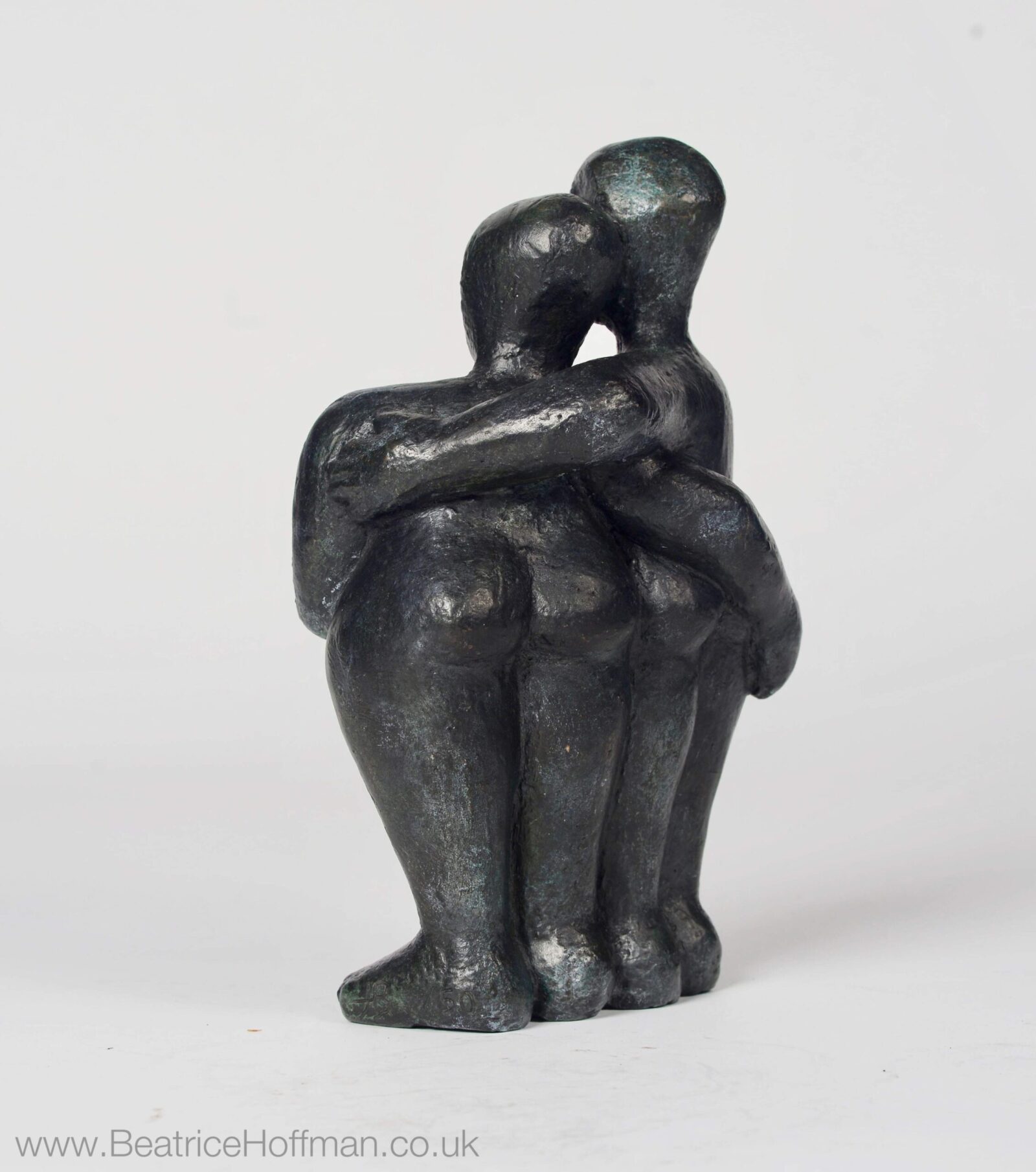 modern affectionate bronze sculpture of a couple for a wedding anniversary