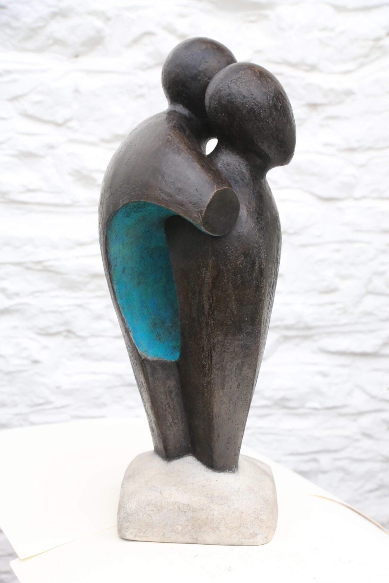 contemporary bronze sculpture of two standing abstract figures for interior design