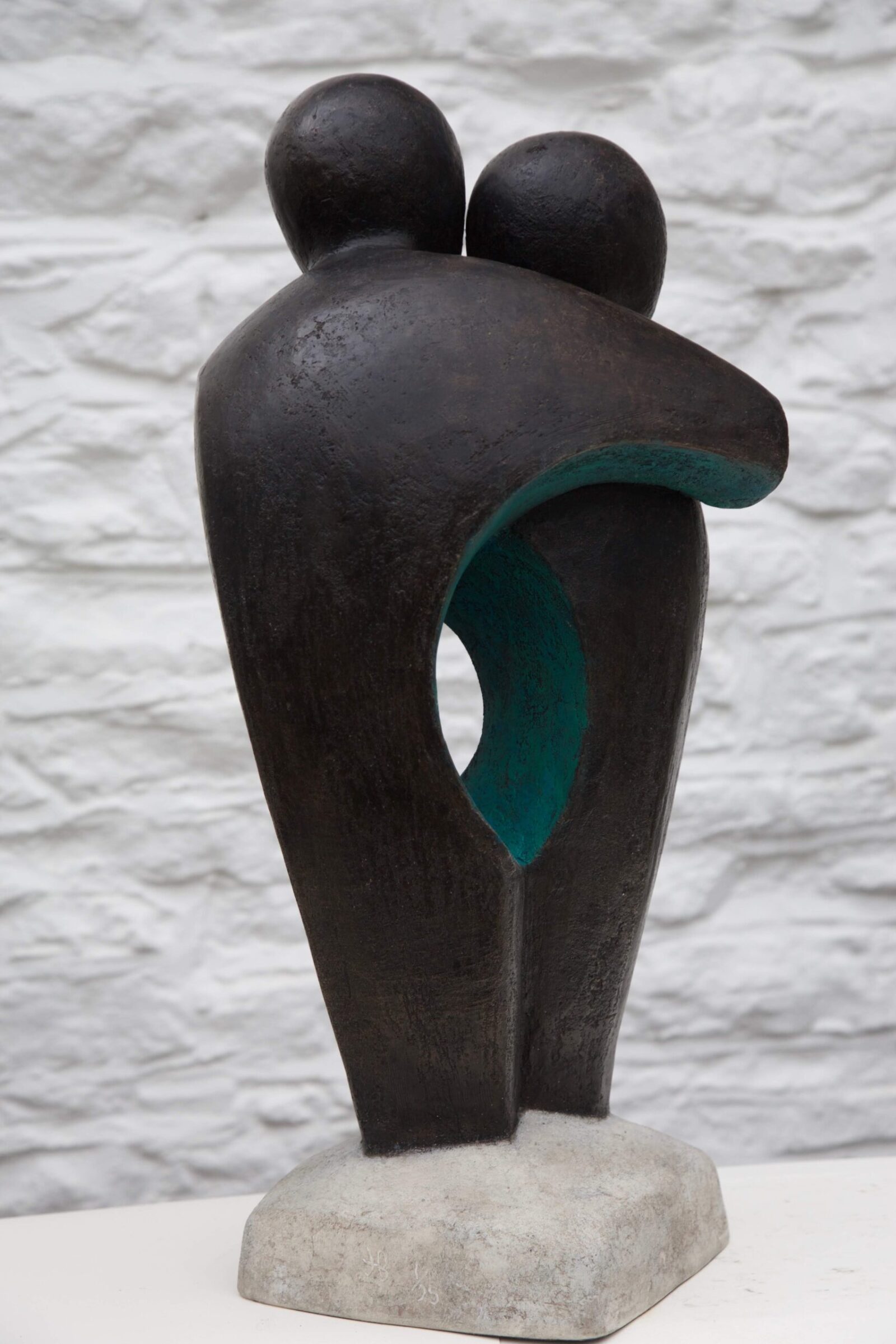 contemporary bronze sculpture of two standing abstract figures for interior design