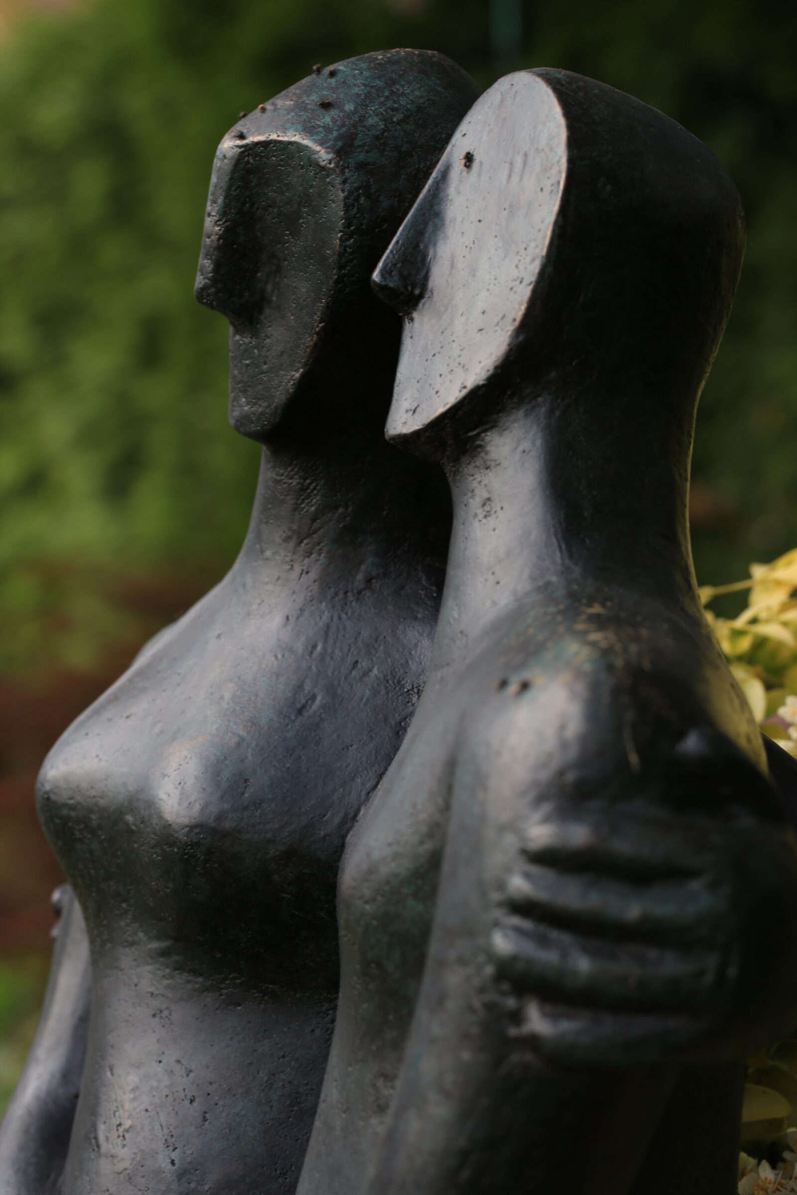 detail of modern bronze sculpture of a couple