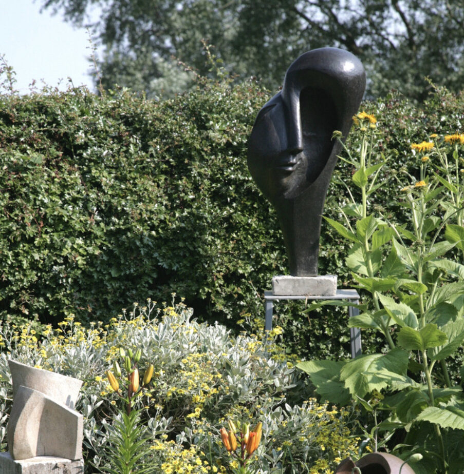 contemporary bronze sculpture of surrealist head for the garden or interior design