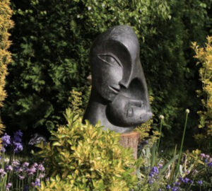 contemporary bronze sculpture of a double head for the garden or interior design