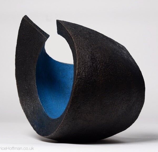 Abstract circular garden bronze sculpture coloured blue and black