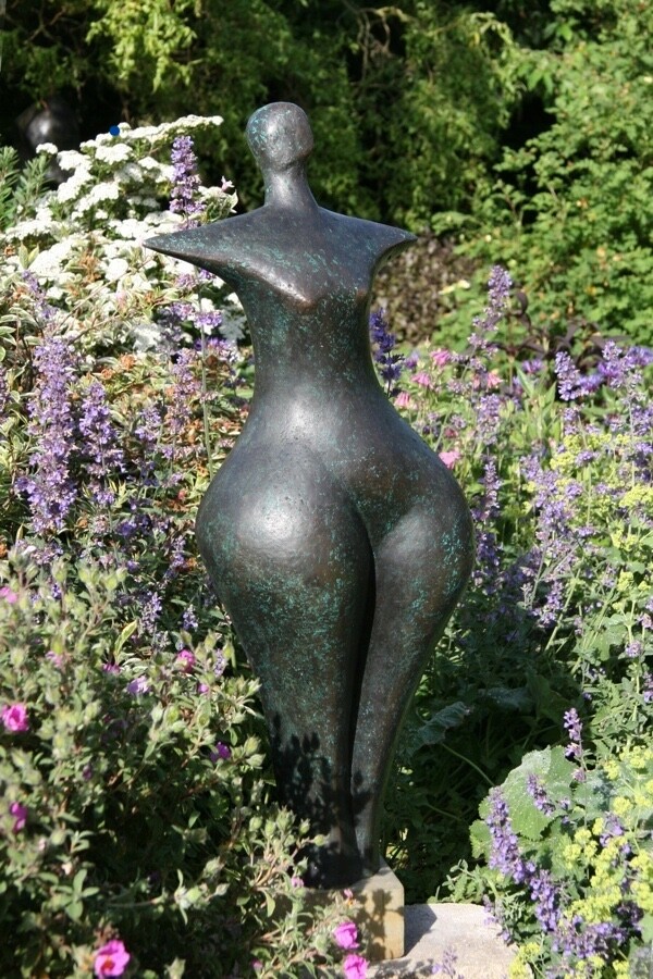 contemporary bronze sculpture of a standing abstract figure for garden or interior design