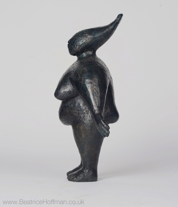 powerful contemporary bronze sculpture of a standing figure for the home
