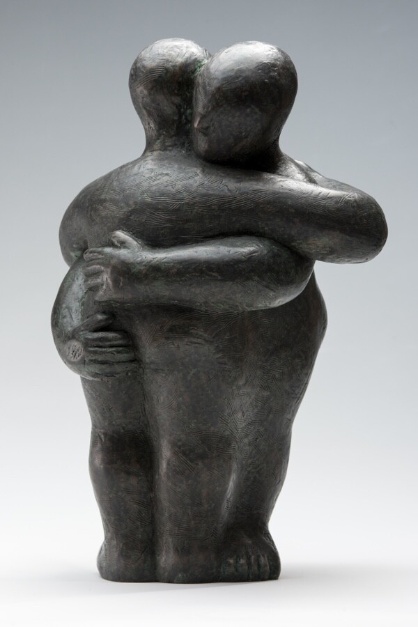 Modern affectionate bronze sculpture of a hug for a wedding anniversary