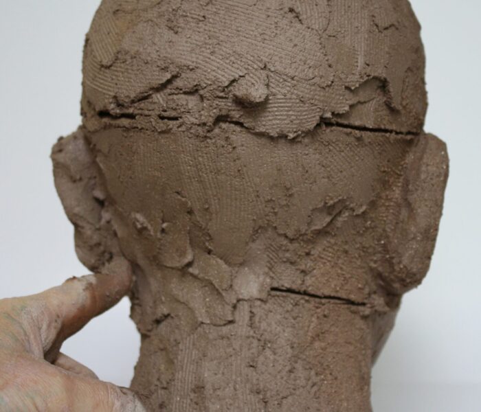 Sculpting a head in clay 