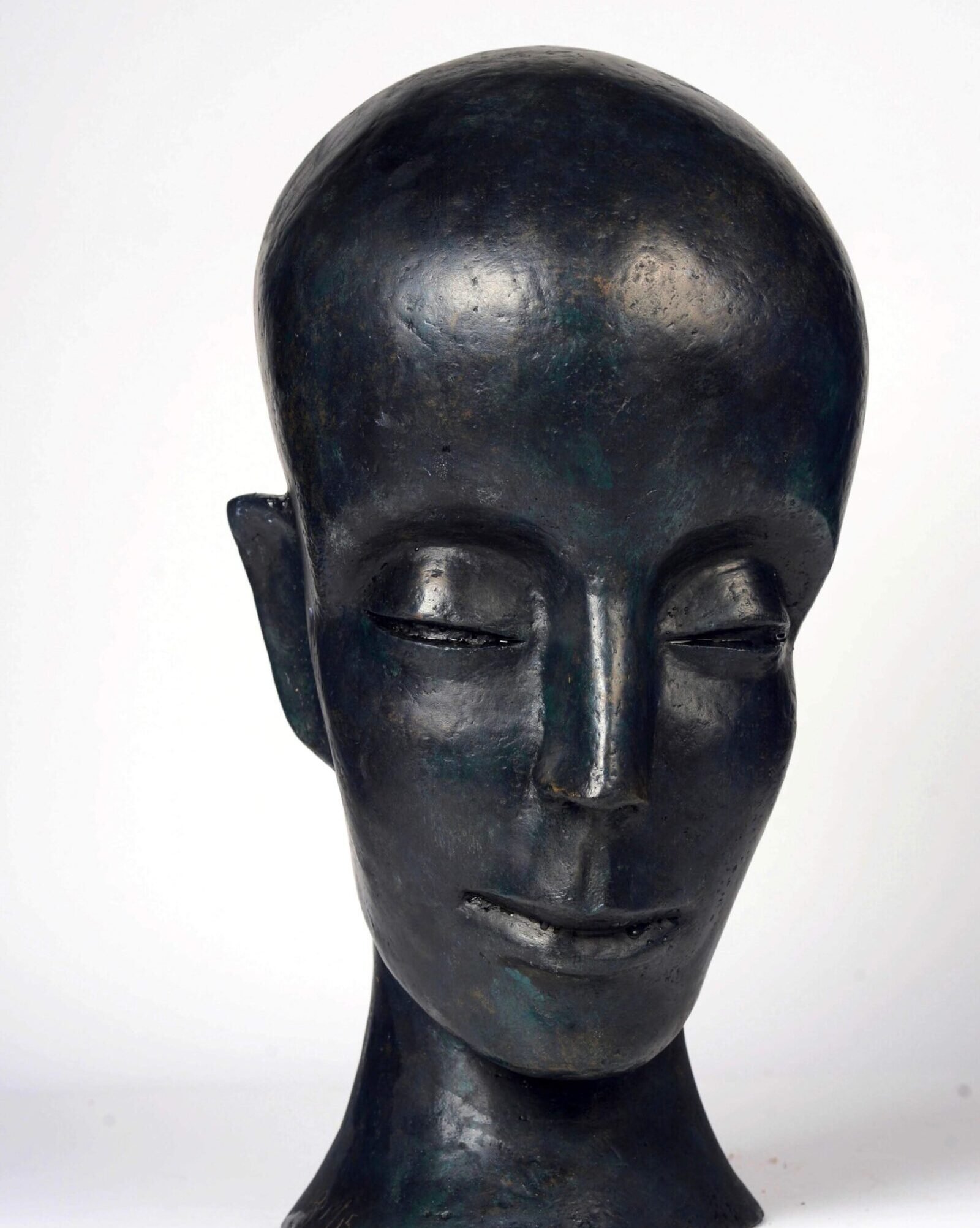 contemporary bronze sculpture of a buddha head