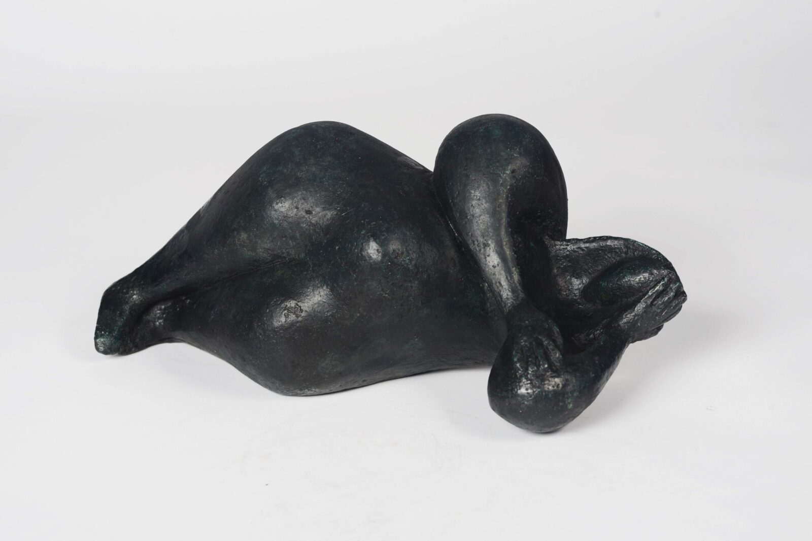 modern bronze sculpture of a lying ample nude for the home