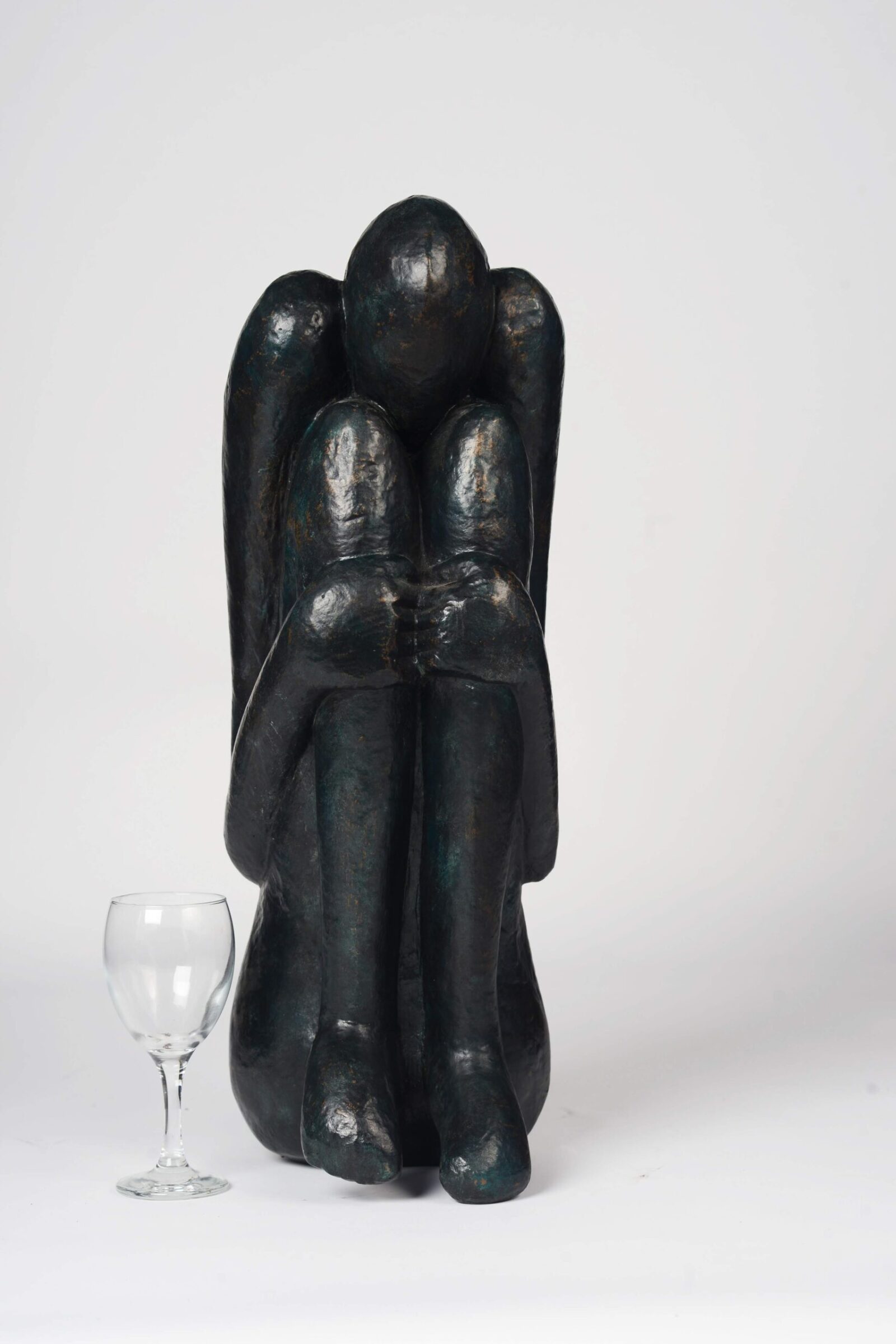 modern bronze sculpture for interior design based on a squatting figure