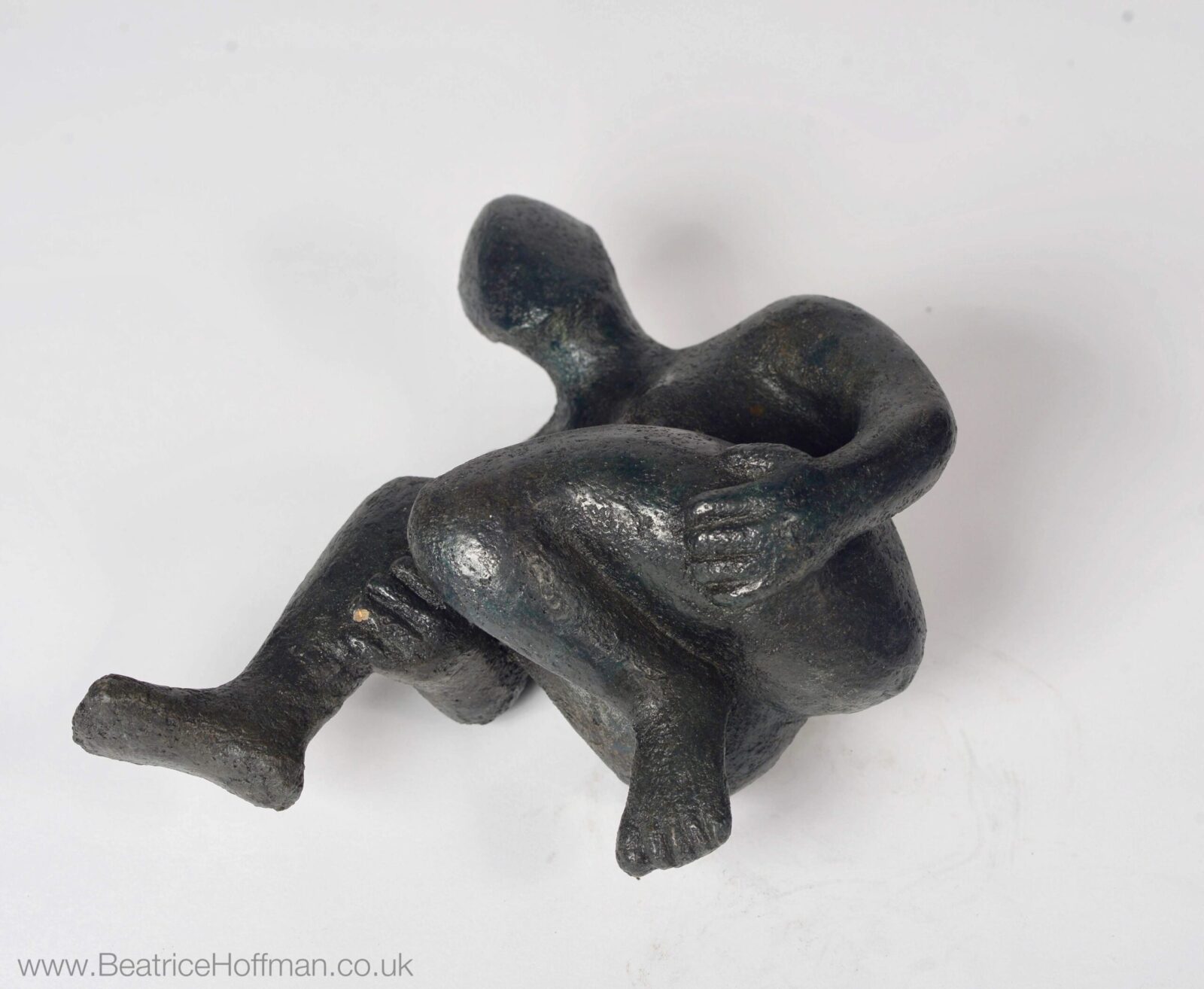 contemporary bronze sculpture of a lying figure for an art collector