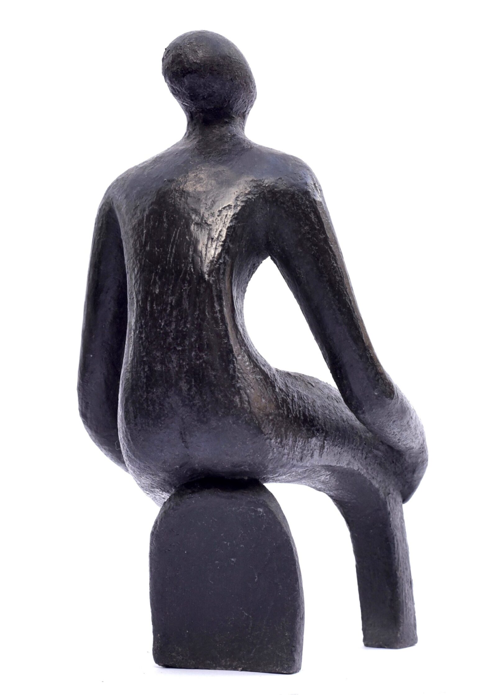 modern sculpture of a siting figure with flowing lines