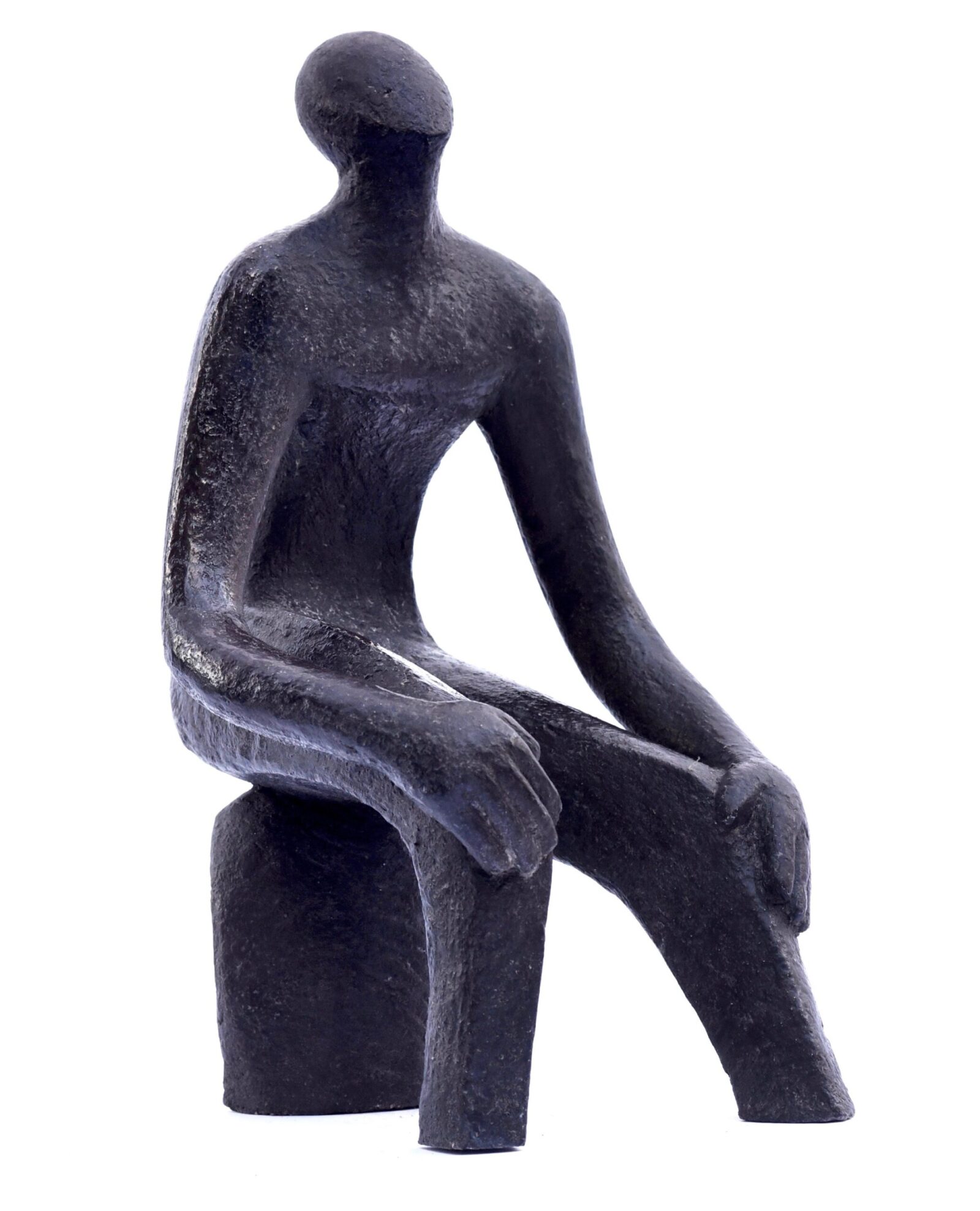 modern sculpture of a siting figure with flowing lines