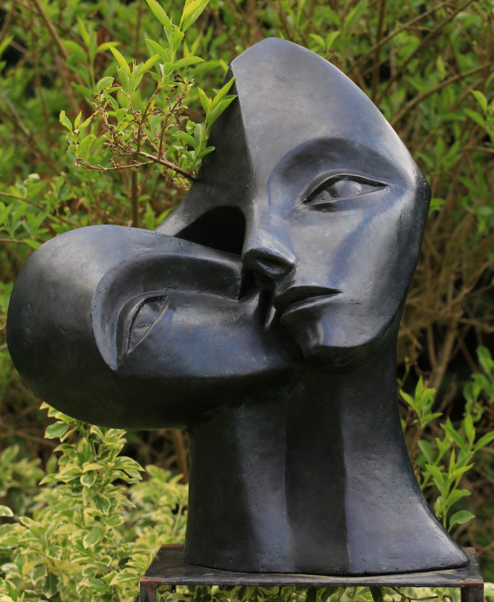 contemporary bronze sculpture of a double head gallery commissioned