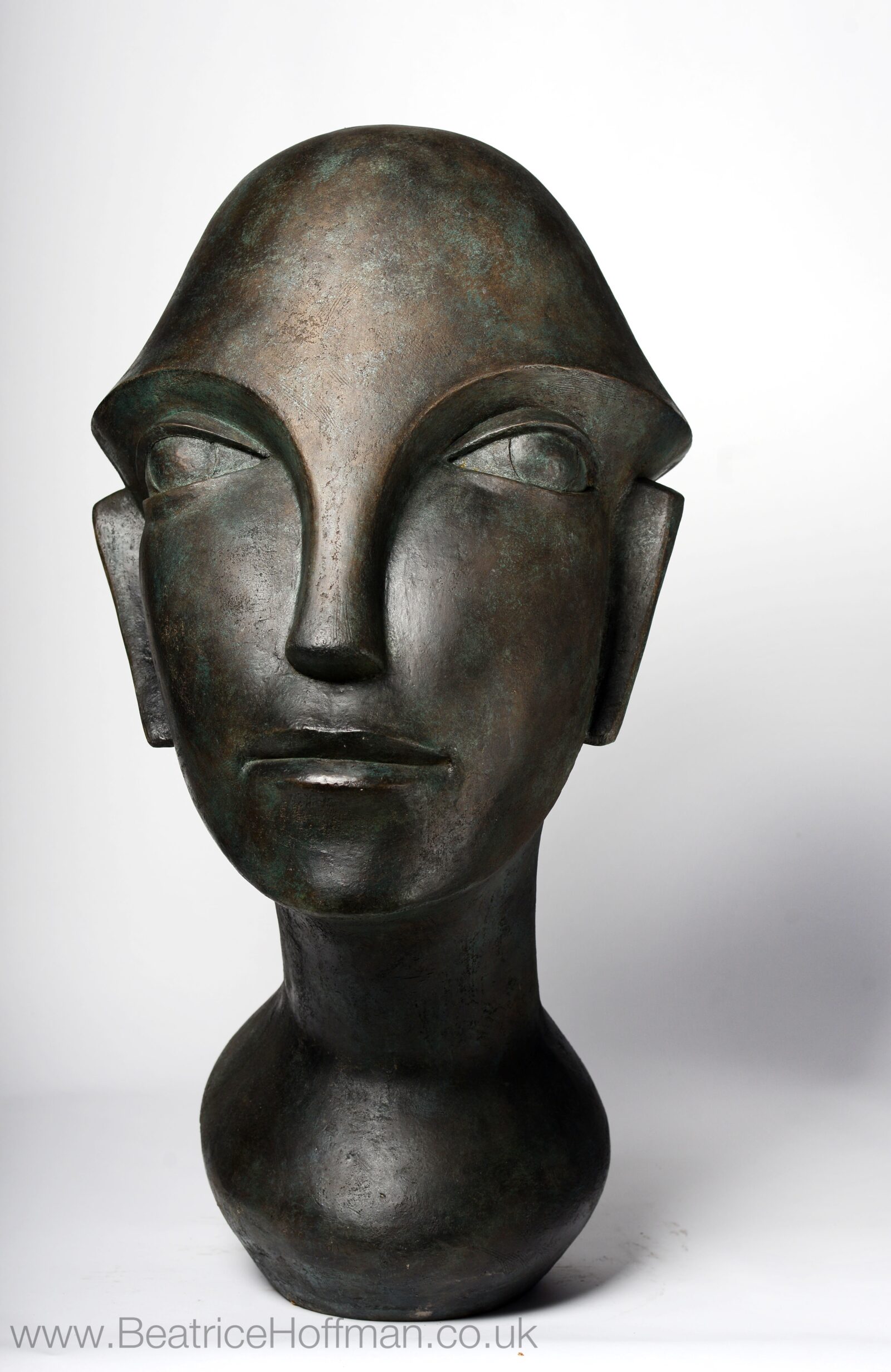 Overlarge abstract sculpture of a modern cubist head suitable as a focal point for the garden and home