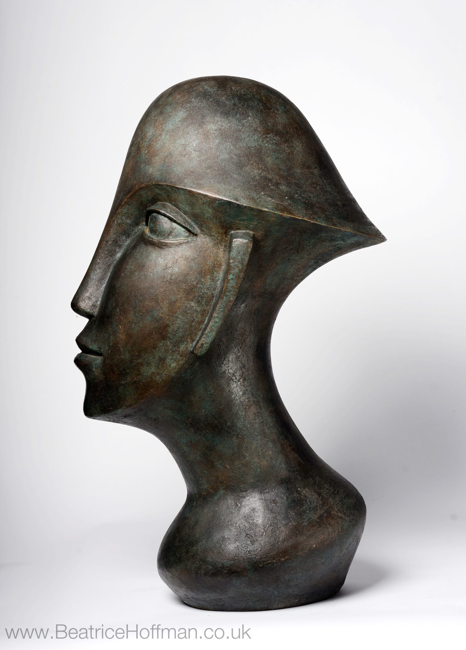 Overlarge abstract sculpture of a modern cubist head suitable as a focal point for the garden and home