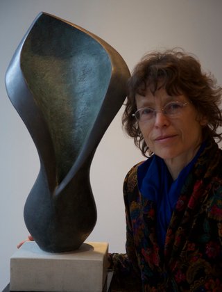 portrait Beatrice Hoffman with modern abstract floral sculpture