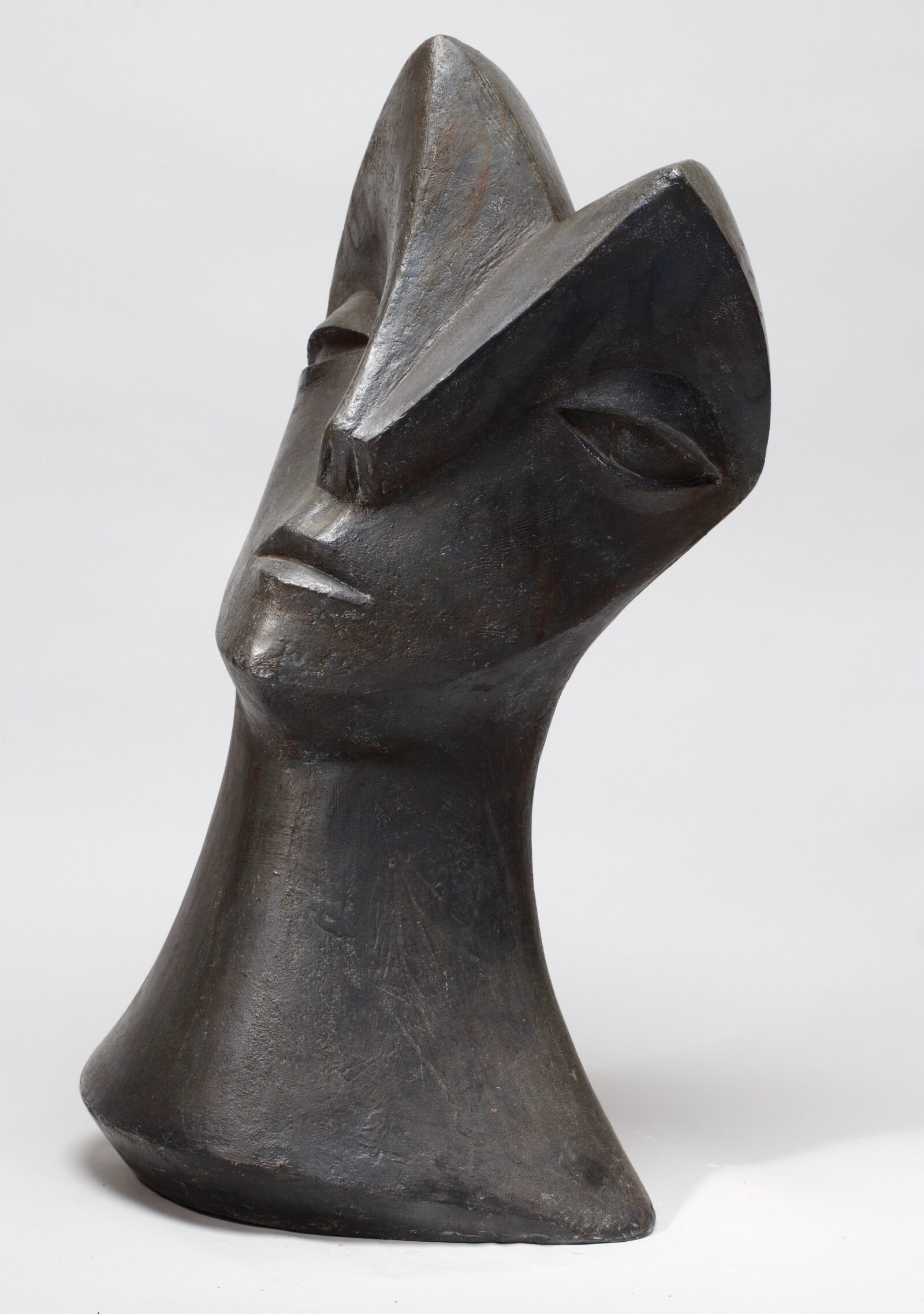 modernist ceramic sculpture of a head inspired by Picasso and African carving