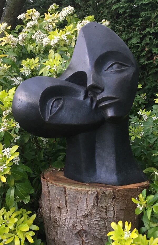 contemporary garden bronze sculpture of a double head based on Picasso