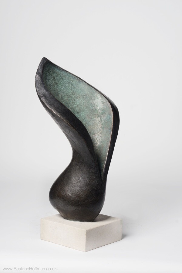 Varied views of a contemporary abstract floral bronze sculpture