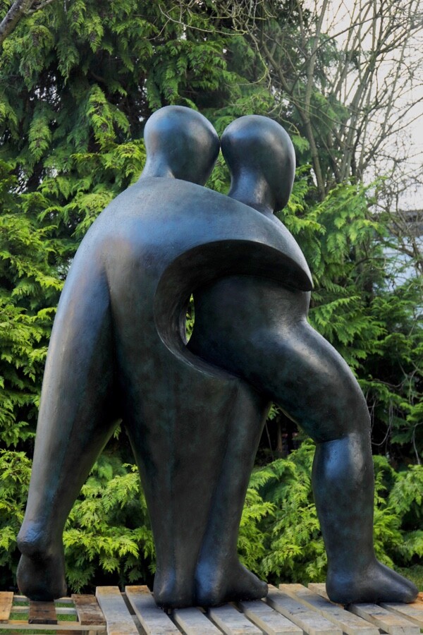 Large hospital commissioned bronze sculpture of two supportive figures