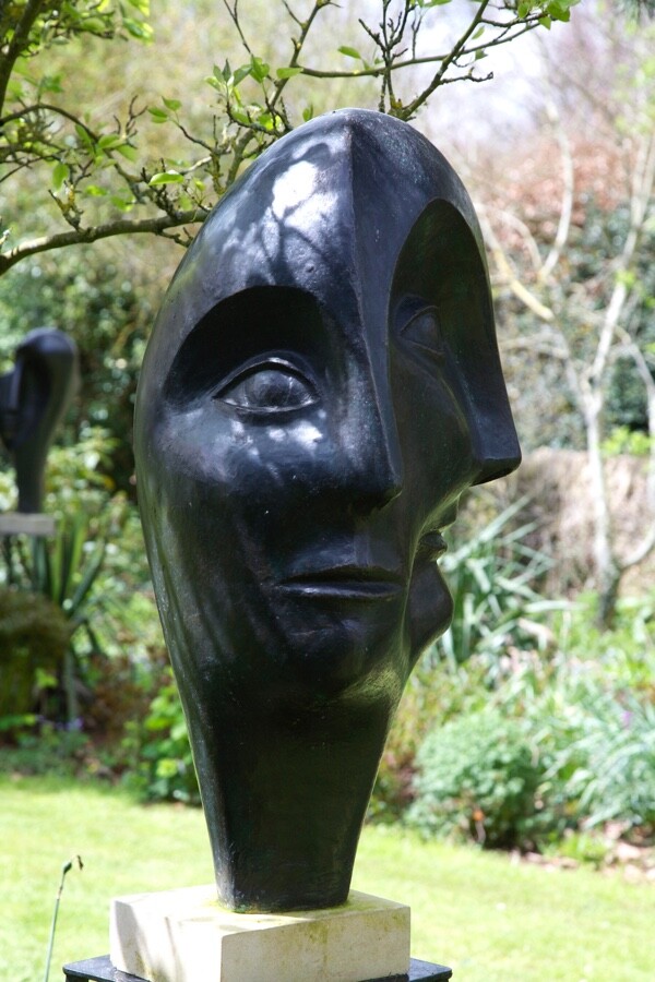 modernist bronze sculpture of head inspired by Picasso for the garden