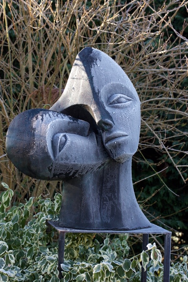 contemporary garden bronze sculpture of a double head based on Picasso