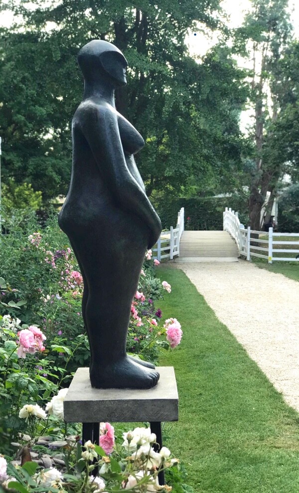 contemporary bronze sculpture of a standing abstract figure for garden or interiors