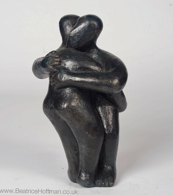 Modern affectionate bronze sculpture of a hug for a wedding anniversary