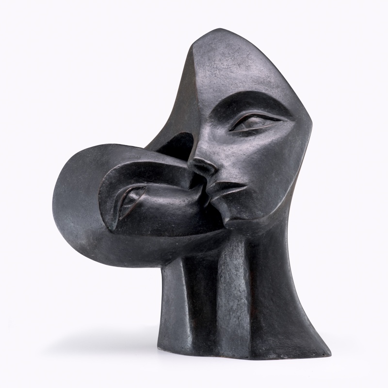 contemporary garden bronze sculpture of a double head loosely based on Picasso