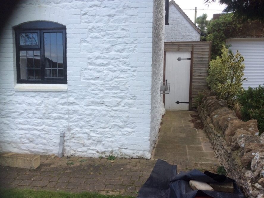 4. Past the front entrance towards the alley way leading to the back garden